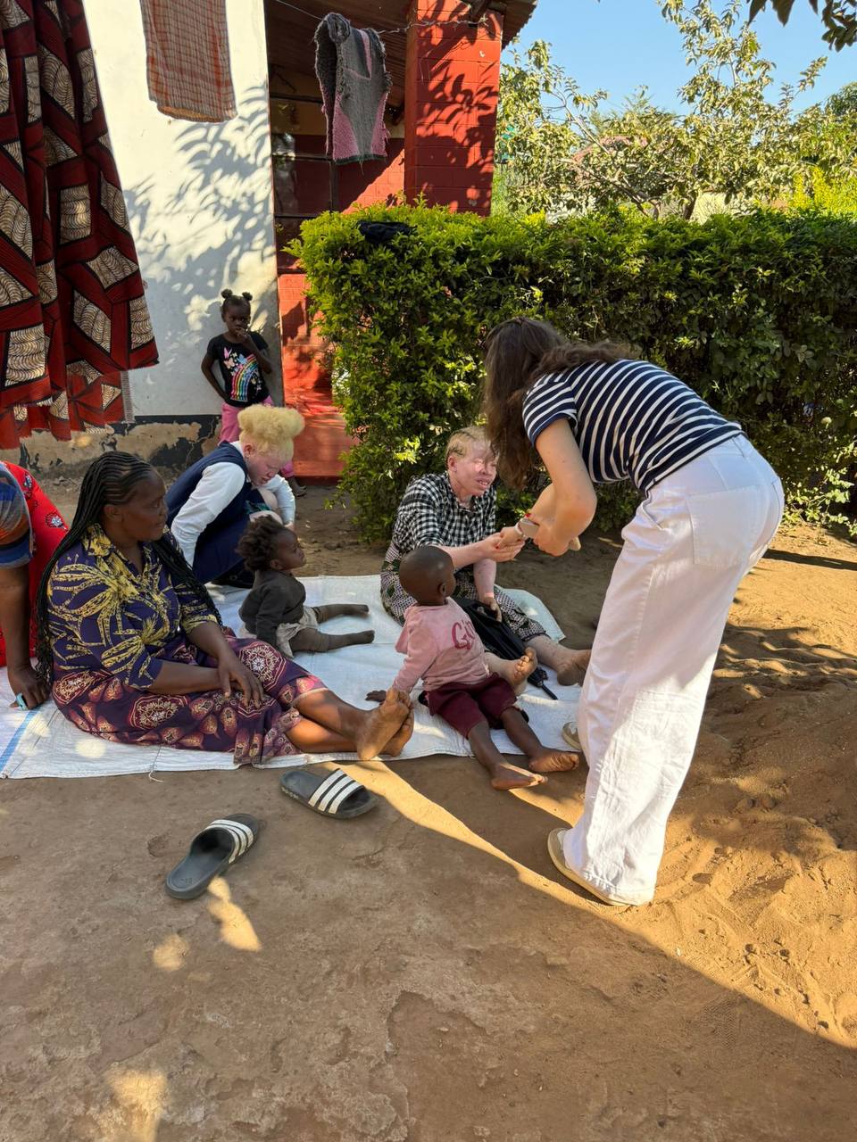 Carolina Khaskelis connecting with people in the albinism community in Zambia